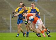 1 July 2012; Caolan Rafferty, Armagh, in action against Peter Domican and Niall Carty, right, Roscommon. GAA Football All-Ireland Senior Championship Qualifier Round 1, Roscommon v Armagh, Dr. Hyde Park, Co. Roscommon. Picture credit: Barry Cregg / SPORTSFILE
