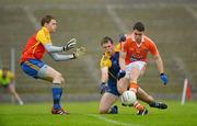 1 July 2012; Caolan Rafferty, Armagh, in action against Niall Carty, centre, and Geoffrey Claffey, Roscommon. GAA Football All-Ireland Senior Championship Qualifier Round 1, Roscommon v Armagh, Dr. Hyde Park, Co. Roscommon. Picture credit: Barry Cregg / SPORTSFILE