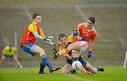 1 July 2012; Caolan Rafferty, Armagh, in action against Niall Carty, centre, and Geoffrey Claffey, Roscommon. GAA Football All-Ireland Senior Championship Qualifier Round 1, Roscommon v Armagh, Dr. Hyde Park, Co. Roscommon. Picture credit: Barry Cregg / SPORTSFILE