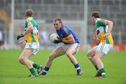 30 June 2012; Peter Acheson, Tipperary, in action against Brian Darby, left, and Michael Brazil, Offaly. GAA Football All-Ireland Senior Championship Qualifier Round 1, Tipperary v Offaly, Semple Stadium, Thurles, Co. Tipperary. Picture credit: Ray Lohan / SPORTSFILE