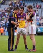 1 July 2012; Wexford manager Jason Ryan, left, speaks with Graeme Molloy, centre, and Anthony Masterson at the end of the game. Leinster GAA Football Senior Championship Semi-Final, Dublin v Wexford, Croke Park, Dublin. Picture credit: David Maher / SPORTSFILE
