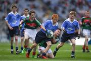 17 September 2017; James Cranny, Bennekerry National School, Bennekerry, Co. Carlow, representing Dublin, Ruairí McCullagh, right,  St. Teresa's P.S., Loughmacrory, Omagh, Co. Tyrone, representing Dublin, and in action against Martin Kirk, left, St. Finloughs PS, Limavady, Co. Derry, representing Mayo, and Ryan Byrne, Cloontuskert NS, Cloontuskert, Lanesboro, Co. Roscommon, representing Mayo, during the INTO Cumann na mBunscol GAA Respect Exhibition Go Games at Dublin v Mayo GAA Football All-Ireland Senior Championship Final at Croke Park in Dublin. Photo by Ray McManus/Sportsfile