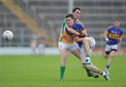 30 June 2012; Michael Quinlivan, Tipperary, in action against Eoin Rigley, Offaly. GAA Football All-Ireland Senior Championship Qualifier Round 1, Tipperary v Offaly, Semple Stadium, Thurles, Co. Tipperary. Picture credit: Ray Lohan / SPORTSFILE