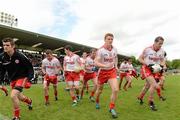 30 June 2012; The Tyrone squad take to the field after the traditional team photograph. Ulster GAA Football Senior Championship Semi-Final, Tyrone v Donegal, St Tiernach's Park, Clones, Co. Monaghan. Picture credit: Oliver McVeigh / SPORTSFILE