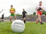 30 June 2012; Donegal captain Michael Murphy, left, and Tyrone captain Stephen O'Neill after the coin toss with referee David Coldrick, centre. Ulster GAA Football Senior Championship Semi-Final, Tyrone v Donegal, St Tiernach's Park, Clones, Co. Monaghan. Picture credit: Oliver McVeigh / SPORTSFILE