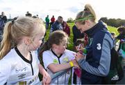 14 September 2017; Diane Caldwell of the Republic of Ireland women's national team signs an autograph during the Aviva Soccer Sisters Golden Camp. Forty girls from the Aviva ‘Soccer Sisters’ initiative were given the opportunity of a lifetime, as they took part in a special training session alongside several members of the Republic of Ireland women’s senior team. The girls were selected from over 4,000 budding footballers between the ages of seven and 12 to take part in the special session at the FAI National Training Centre, as part of the 2017 Aviva Soccer Sisters Golden Camp. The Camp saw the girls sit in on a full Irish team training session, before taking to the field with the team ahead of next Tuesday’s FIFA World Cup Qualifier against Northern Ireland. The Aviva Soccer Sisters programme has been running since 2010 and is aimed at engaging young girls in physical exercise and attracting them to the game of football. Over 30,000 girls have taken part in the programme since it first kicked off, including Roma McLaughlin who is part of Colin Bell’s line-up for next week’s qualifier.  For further information on Aviva Soccer Sisters, visit: www.aviva.ie/soccersisters  #AvivaSoccerSisters. FAI National Training Centre, Abbotstown, Dublin. Photo by Stephen McCarthy/Sportsfile