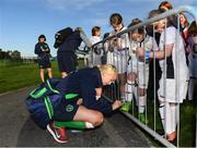 14 September 2017; Stephanie Roche of the Republic of Ireland women's national team signs an autogrpah for Emma Maher, age 8, from Laois, during the Aviva Soccer Sisters Golden Camp. Forty girls from the Aviva ‘Soccer Sisters’ initiative were given the opportunity of a lifetime, as they took part in a special training session alongside several members of the Republic of Ireland women’s senior team. The girls were selected from over 4,000 budding footballers between the ages of seven and 12 to take part in the special session at the FAI National Training Centre, as part of the 2017 Aviva Soccer Sisters Golden Camp. The Camp saw the girls sit in on a full Irish team training session, before taking to the field with the team ahead of next Tuesday’s FIFA World Cup Qualifier against Northern Ireland. The Aviva Soccer Sisters programme has been running since 2010 and is aimed at engaging young girls in physical exercise and attracting them to the game of football. Over 30,000 girls have taken part in the programme since it first kicked off, including Roma McLaughlin who is part of Colin Bell’s line-up for next week’s qualifier.  For further information on Aviva Soccer Sisters, visit: www.aviva.ie/soccersisters  #AvivaSoccerSisters. FAI National Training Centre, Abbotstown, Dublin. Photo by Stephen McCarthy/Sportsfile
