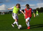 14 September 2017; Lauren Corcoran, age 9, of Killenaule Moyglass Ladies, Tipperary, left, and Sadhbh Simpson, age 9, of Newbridge Town FC, Kildare, during the Aviva Soccer Sisters Golden Camp. Forty girls from the Aviva ‘Soccer Sisters’ initiative were given the opportunity of a lifetime, as they took part in a special training session alongside several members of the Republic of Ireland women’s senior team. The girls were selected from over 4,000 budding footballers between the ages of seven and 12 to take part in the special session at the FAI National Training Centre, as part of the 2017 Aviva Soccer Sisters Golden Camp. The Camp saw the girls sit in on a full Irish team training session, before taking to the field with the team ahead of next Tuesday’s FIFA World Cup Qualifier against Northern Ireland. The Aviva Soccer Sisters programme has been running since 2010 and is aimed at engaging young girls in physical exercise and attracting them to the game of football. Over 30,000 girls have taken part in the programme since it first kicked off, including Roma McLaughlin who is part of Colin Bell’s line-up for next week’s qualifier.  For further information on Aviva Soccer Sisters, visit: www.aviva.ie/soccersisters  #AvivaSoccerSisters. FAI National Training Centre, Abbotstown, Dublin. Photo by Stephen McCarthy/Sportsfile