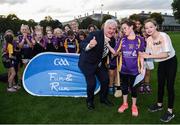 22 September 2017; Uachtarán Chumann Lúthchleas Gael Aogán Ó Fearghail gives a certificate and medal to Johanna Ward, age 10, from Kilmacud Crokes, during the GAA Fun & Run Launch at Culture Night at Trinity College Cricket Ground in Dublin. GAA Fun & Run is a specially designed programme which focuses upon the integration and inclusion of people with disabilities in Gaelic games, while also giving participants the opportunity to take part in 60 minutes of moderate to vigorous activity. Photo by Cody Glenn/Sportsfile