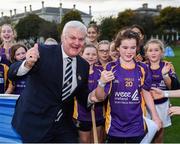 22 September 2017; Uachtarán Chumann Lúthchleas Gael Aogán Ó Fearghail gives a certificate and medal to Johanna Ward, age 10, from Kilmacud Crokes, during the GAA Fun & Run Launch at Culture Night at Trinity College Cricket Ground in Dublin. GAA Fun & Run is a specially designed programme which focuses upon the integration and inclusion of people with disabilities in Gaelic games, while also giving participants the opportunity to take part in 60 minutes of moderate to vigorous activity. Photo by Cody Glenn/Sportsfile