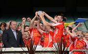 7 July 2012; Padraig Pearses team captains from left, Lorcan Daly, Karl Feehily and Daniel Glynn, lift the Division 4 Trophy as their team-mates celebrate. Padraig Pearses, Co Roscommon, v Eoghan Ruadh, Co Tyrone, Féile na nGael Átha Cliath 2012, Division 4 Final, Croke Park, Dublin. Picture credit: Matt Browne / SPORTSFILE