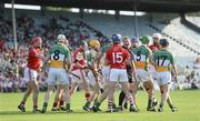7 July 2012; Referee Michael Wadding seperates players from both side's during an off the ball tussle. GAA Hurling All-Ireland Senior Championship Phase 2, Cork v Offaly, Pairc Ui Chaoimh, Cork. Picture credit: Stephen McCarthy / SPORTSFILE