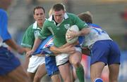 21 September 2002; John Kelly of Ireland is tackled by Andrei Kuzin, 14, and Konstantin Rachkov of Russia during the Rugby World Cup 2003 Qualifier match between Ireland and Russia at Krasnoyarsk Stadium in Krasnoyarsk, Russia. Photo by Aoife Rice/Sportsfile