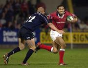 20 September 2002; Jeremy Staunton of Munster is tackled by Steve Winn of Swansea during the Celtic League Pool A match between Munster and Swansea at Musgrave Park in Cork. Photo by Brendan Moran/Sportsfile
