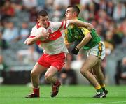 22 September 2002; Paul Young of Derry in action against Ger McCullagh of Meath during the GAA Football All-Ireland Minor Championship Final match between Derry and Meath at Croke Park in Dublin. Photo by Brendan Moran/Sportsfile