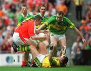 22 September 2002; Oisin McConville of Armagh is tackled by Kerry goalkeeper Declan O'Keeffe and Seamus Moynihan which led to an Armagh penalty during the GAA Football All-Ireland Senior Championship Final match between Armagh and Kerry at Croke Park in Dublin. Photo by David Maher/Sportsfile