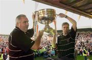 23 September 2002; Manager Joe Kernan, left, and captain Kieran McGeeney, hold aloft the Sam Maguire cup, during the homecoming of Armagh, All-Ireland Senior Football Champions, at Crossmaglen Rangers, in Crossmaglen, Armagh. Photo by Brendan Moran/Sportsfile
