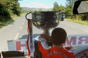 23 September 2002; Ross Kernan, son of Armagh manager Joe, keeps an eye on the Sam Maguire cup on their journey back to Armagh for the teams homecoming after winning the All-Ireland Senior Football Championship. Photo by Damien Eagers/Sportsfile