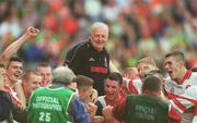 22 September 2002; Derry manager Chris Brown celebrates with his team following their victory in the GAA Football All-Ireland Minor Championship Final match between Derry and Meath at Croke Park in Dublin. Photo by Ray McManus/Sportsfile