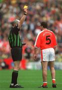 22 September 2002; Aidan O'Rourke of Armagh is shown a yellow card by referee John Bannon during the GAA Football All-Ireland Senior Championship Final match between Armagh and Kerry at Croke Park in Dublin. Photo by Brendan Moran/Sportsfile