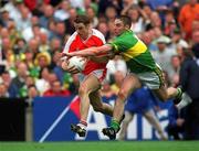22 September 2002; Paul McGrane of Armagh in action against Darragh O'Se of Kerry during the GAA Football All-Ireland Senior Championship Final match between Armagh and Kerry at Croke Park in Dublin. Photo by Brian Lawless/Sportsfile