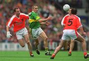 22 September 2002; Sean O'Sullivan of Kerry in action against Andrew McCann, left, and Aidan O'Rourke of Armagh during the GAA Football All-Ireland Senior Championship Final match between Armagh and Kerry at Croke Park in Dublin. Photo by Brian Lawless/Sportsfile
