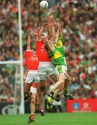 22 September 2002; Aidan O'Rourke, left, and Enda McNulty of Armagh contest a high ball with Donal Daly, behind, and Michael Francis Russell of Kerry during the GAA Football All-Ireland Senior Championship Final match between Armagh and Kerry at Croke Park in Dublin. Photo by Ray McManus/Sportsfile