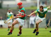 29 September 2002; Paul Molloy of Birr in action against Henry Kilmartin of Kilcormac / Killoughey during the Offaly County Senior Hurling Final match between Birr and Kilcormac / Kelloughey at St. Brendan's Park in Birr, Offaly. Photo by David Maher/Sportsfile