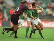 28 September 2002; Girvan Dempsey of Ireland is tackled by Bessik Khamashuridze of Georgia during the Rugby World Cup 2003 Qualifier match between Ireland and Georgia at Lansdowne Road in Dublin. Photo by Brendan Moran/Sportsfile