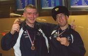 30 September 2002; Ireland's Special Olympics Basketball players Michael O'Connor, left, with team-mate Patrick Nolan, from Wexford, who competed at the European Basketball Tournament in Moscow, pictured with their medals, on their arrival home at Dublin Airport in Dublin. Photo by Aoife Rice/Sportsfile
