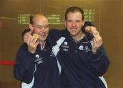 30 September 2002; Ireland's Special Olympics Basketball Captain, Fintan Broaders, with team-mate Noel Murphy, from Wexford, who competed at the European Basketball Tournament in Moscow, pictured with their medals, on their arrival home at Dublin Airport in Dublin. Photo by Aoife Rice/Sportsfile