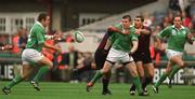 28 September 2002; Brian O'Driscoll of Ireland passes the ball to team-mate Kevin Maggs despite the tackle of Kakha Alania and Tedo Zibzibadze of Georgia during the Rugby World Cup 2003 Qualifier match between Ireland and Georgia at Lansdowne Road in Dublin. Photo by Brendan Moran/Sportsfile