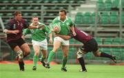28 September 2002; Rob Henderson of Ireland is tackled by George Chkhaidze, left, and Paul Jimsheladze of Georgia during the Rugby World Cup 2003 Qualifier match between Ireland and Georgia at Lansdowne Road in Dublin. Photo by Brendan Moran/Sportsfile