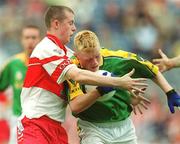 22 September 2002; Caoimhin King of Meath is tackled by Barry McGolderick of Derry during the GAA Football All-Ireland Minor Championship Final match between Derry and Meath at Croke Park in Dublin. Photo by Brendan Moran/Sportsfile