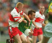 22 September 2002; Sean Stephens of Meath is tackled by Cathal O'Kane of Derry during the GAA Football All-Ireland Minor Championship Final match between Derry and Meath at Croke Park in Dublin. Photo by Brendan Moran/Sportsfile
