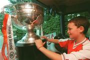 23 September 2002; Ross Kernan, son of Armagh manager Joe, keeps an eye on the Sam Maguire cup on their journey back to Armagh for the teams homecoming after winning the All-Ireland Senior Football Championship. Photo by Damien Eagers/Sportsfile
