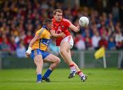 8 July 2012; Ciaran Sheehan, Cork, in action against Graham Kelly, Clare. Munster GAA Football Senior Championship Final, Cork v Clare, Gaelic Grounds, Limerick. Picture credit: Stephen McCarthy / SPORTSFILE