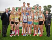 8 July 2012; Medallists in the Women's 4x400m Team Relay, from left, third place Leevale A.C, Co.Cork, winners DSD A.C, Dublin and third place Raheny Shamrock A.C, Co. Dublin, are presented with their medals by Ray Colman, left, Chief Executive, Woodie's DIY, and Professor Ciarán Ó Catháin, right, President, Athletics Ireland. Woodie’s DIY Senior Track and Field Championships of Ireland, Morton Stadium, Santry, Dublin. Picture credit: Tomas Greally / SPORTSFILE