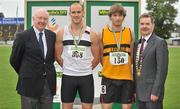 8 July 2012; Medallists in the Men's 110m Hurdles, from left, gold medallist Simon Taggart, Donore Harriers AC, Dublin, and silver medallist Edmond O'Halloran, Leevale AC, Cork, are presented with their medals by Ray Colman, 2nd left, Chief Executive, Woodies DIY and Professor Ciarán Ó Catháin, President, Athletics Ireland. Woodie’s DIY Senior Track and Field Championships of Ireland, Morton Stadium, Santry, Dublin. Picture credit: Brendan Moran / SPORTSFILE