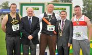 8 July 2012; Medallists in the Men's Discus, from left, bronze medallist Daniel Clifford, Farranfore Maine Valley AC, gold medallist Tomas Rauktys, Clonliffe Harriers AC, Dublin, and silver medallist Sean Breathnach, Galway City Harriers AC, are presented with their medals by Ray Colman, 2nd left, Chief Executive, Woodies DIY and Professor Ciarán Ó Catháin, President, Athletics Ireland. Woodie’s DIY Senior Track and Field Championships of Ireland, Morton Stadium, Santry, Dublin. Picture credit: Brendan Moran / SPORTSFILE