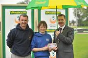 8 July 2012; Voucher winner Luke O'Brien, from Waterford, presented with his prize by Professor Ciarán Ó Catháin, President, Athletics Ireland. Woodie’s DIY Senior Track and Field Championships of Ireland, Morton Stadium, Santry, Dublin. Picture credit: Brendan Moran / SPORTSFILE