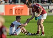 24 September 2017; Se McGuigan of Slaughtneil commiserates with Carlus McWilliams of Ballinascreen after the Derry County Senior Football Championship Final match between Slaughtneil and Ballinascreen at Celtic Park in Derry. Photo by Oliver McVeigh/Sportsfile