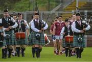 24 September 2017; Christopher McKaigue of Slaughtneil behind the St Colmcilles Pipe band during the pre match parade in the Derry County Senior Football Championship Final match between Slaughtneil and Ballinascreen at Celtic Park in Derry. Photo by Oliver McVeigh/Sportsfile