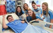 25 September 2017; Rory Whelan, age 14, from Fethard-on-Sea, Co Wexford, celebrates with the Brendan Martin Cup and Dublin Senior Ladies Footballers, from left, Lyndsey Davey, Rebecca McDonnell, Lauren Magee, Hannah O'Neill, and Emily Flanagan, in attendance during the All-Ireland Senior Ladies Football Champions visit to Temple Street Children's Hospital at Temple Street Children’s Hospital, in Dublin. Photo by Cody Glenn/Sportsfile