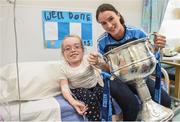 25 September 2017; Dublin Senior Ladies Football captain Sinéad Aherne brings the Brendan Martin Cup to the room of Grace Cogan, age 10, from Carrickmacross, Co Monaghan, in attendance during the All-Ireland Senior Ladies Football Champions visit to Temple Street Children's Hospital at Temple Street Children’s Hospital, in Dublin. Photo by Cody Glenn/Sportsfile