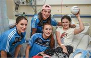 25 September 2017; Sarah Burton, age 11, from Navan Road, Dublin, is visited by Dublin Senior Ladies Footballers, from left, Sinéad Aherne, Denise McKenna, and Lauren Magee, in attendance during the All-Ireland Senior Ladies Football Champions visit to Temple Street Children's Hospital at Temple Street Children’s Hospital, in Dublin. Photo by Cody Glenn/Sportsfile