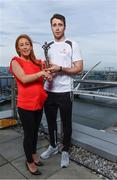 26 September 2017; Marie Coady, Tax Partner PwC, presents Galway hurler Conor Cooney with his PwC GAA/GPA Player of the Month Award for July at a reception in PwC Offices, Dublin. Photo by Sam Barnes/Sportsfile