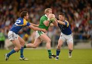 14 July 2012; Stephen Kelly, Limerick, in action against Niall Mulligan, left, and Mickey Quinn, Longford. GAA Football All-Ireland Senior Championship Qualifier, Round 2, Longford v Limerick, Glennon Brothers Pearse Park, Longford. Picture credit: Ray McManus / SPORTSFILE