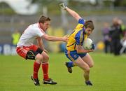 14 July 2012; Cathal Cregg, Roscommon, in action against Dermot Carlin, Tyrone. GAA Football All-Ireland Senior Championship Qualifier, Round 2, Roscommon v Tyrone, Dr. Hyde Park, Roscommon. Picture credit: Barry Cregg / SPORTSFILE
