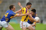 14 July 2012; Lee Chin, Wexford, in action against Peter Acheson,14, and Donagh Leahy, Tipperary. GAA Football All-Ireland Senior Championship Qualifier, Round 2, Tipperary v Wexford, Semple Stadium, Thurles, Co. Tipperary. Picture credit: Matt Browne / SPORTSFILE
